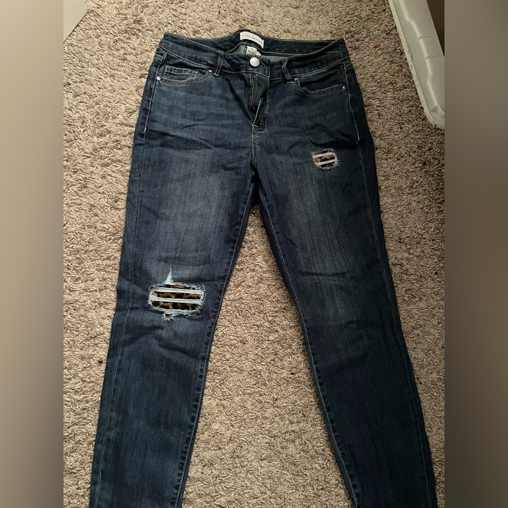 Lane Bryant dark distressed jeans with cheetah print